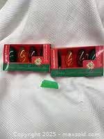 Front view of two boxed sets of Christmas bulbs