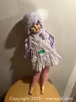 Full view of 29-inch doll standing on surface