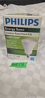 Front of Philips Energy Saver Outdoor Flood R30 bulb box showing wattage, lifespan, brightness