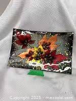 Front of rectangular fused glass plate showing multicolour leaf design