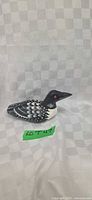 Left side view of hand-carved painted loon figurine