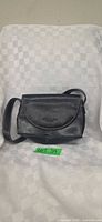 Full view of black leather Reaction Kenneth Cole purse