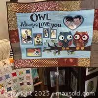 Front view of hanging photo quilt showing design and photo pockets