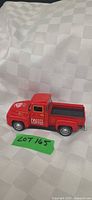 Full view driver side of red die-cast coffee pickup toy