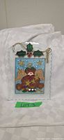 Front view of stained glass bear angel panel with hanging chain