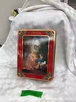 Front of 1992 Oreo Christmas tin standing upright