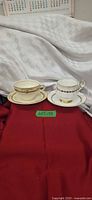 Two teacup and saucer sets displayed