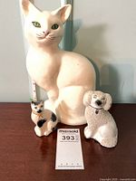 Front view of Beswick cat, Staffordshire poodle and kitten