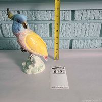 Front view of Beswick cockatoo figurine with ruler and lot card