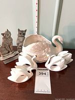 Entire lot with pewter cat bookends, swan vase, four swan napkin rings