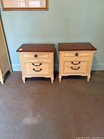 Front view of both night tables showing drawer fronts and hardware