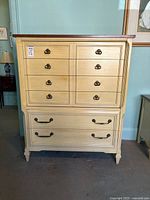 Front view showing six drawers and hardware