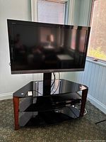 Front view of Sony 46" TV on black glass stand