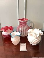 Group shot: two hobnail vases, honeycomb vase, cranberry swirl pitcher