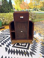 Full view of Art Deco nightstand showing drawer, cupboard, side shelves, curved edges