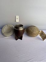 All three items: haggis bank, marble ashtray, mate cup