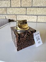 Overall view showing cube lighter, glass pattern, metal top