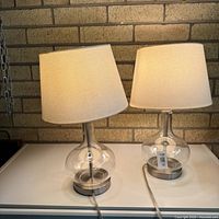 Both matching bedside lamps on table showing overall design