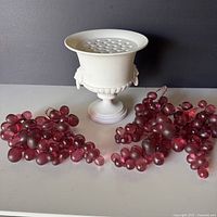 Urn with flower frog lid and three grape bunches front view