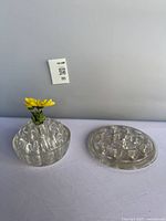 Domed and disc flower frogs standing, size reference tag visible