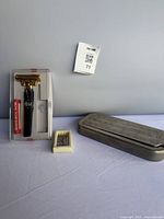 Pal Injectomatic razor in display box, Rolls Razor closed metal case, blade dispenser visible