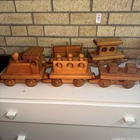 Locomotive, passenger car and caboose close-up