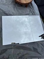 Two of the square mirrors showing reflective surface outdoors