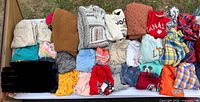 All 20 pieces of size 4T children’s clothing laid out in two rows on table