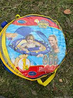 Front of packaged SwimWays Baby Spring Float showing product image and branding