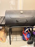 Full view of grill with charcoal bags beneath