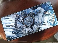 Tin lid with wildlife artwork