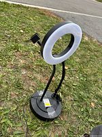 Full view of ring light on stand with phone holder and cord