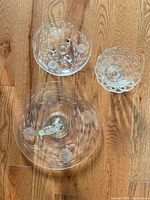 Overview of all glass dishes showing platter, footed plate and small bowl