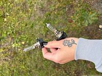 Two H11 HID bulbs showing metal bases and clear glass tubes