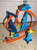Assembled Hot Wheels track set showing two loops, supports and accessories