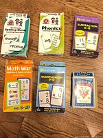 All six boxed decks displayed on wooden floor