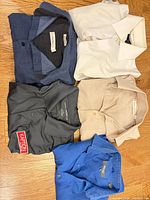 Overview of five shirts laid out