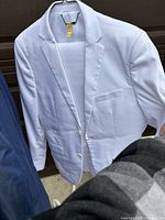 White two-button blazer front view on hanger