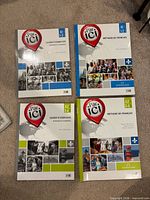 All four Par ici books laid out