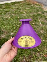 Side view of purple Scrape-A-Round cone ice scraper