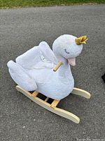 Full view of plush swan rocker showing rails, seat, harness, crown and overall condition
