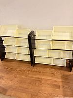 Both toy storage shelf units side by side with bins visible