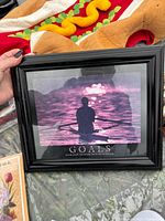 Framed motivational print showing rower on water with word GOALS