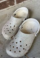 Top view of both glitter Crocs showing overall condition