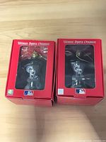 Front view of two boxed Colorado Rockies ornaments