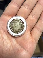 Obverse of 1929 British India George V 2 Annas coin in capsule