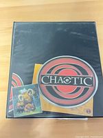 Closed black binder with Chaotic logo on cover