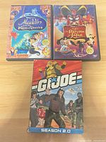 Front view of three DVD cases: Aladdin and the King of Thieves, Aladdin The Return of Jafar, G.I. Joe Season 2.0