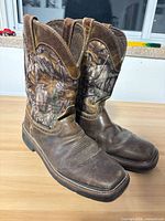 Left and right side view of both boots showing leather foot and camouflage shaft