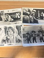 All four movie stills laid out on table